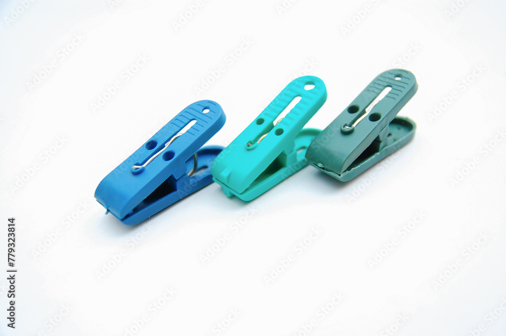 Plastic clothespin isolated on a white background. Selective focus. Copy space. Plastic clothespin isolated on a white background. Selective focus. Copy space.
