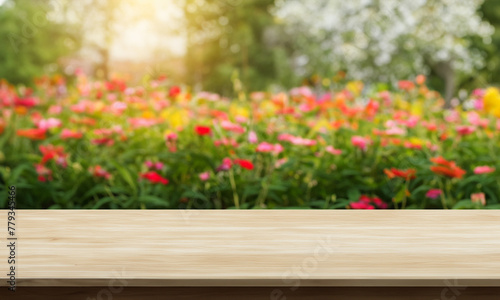 natural horizontal wood table background with flower garden behind © oliv-walk