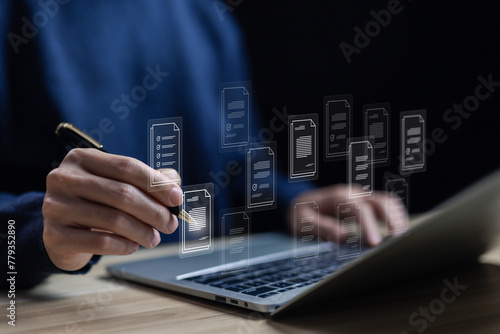 businessman manages data on a laptop, business paperless, document files digital electronic. concept Enterprise Resource Planning system or ERP is software for management recorded in a Database.