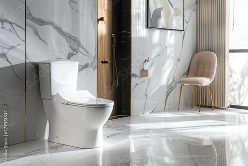A white toilet with a black lid sits in a bathroom with a marble wall. The toilet is a modern design with a touch of luxury. The bathroom is clean and well-maintained  with a chair placed nearby