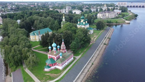Picturesque aerial view of modern townscape of Uglich overlooking dam on Volga River on summer day, Yaroslavl region, Russia. High quality 4k footage photo