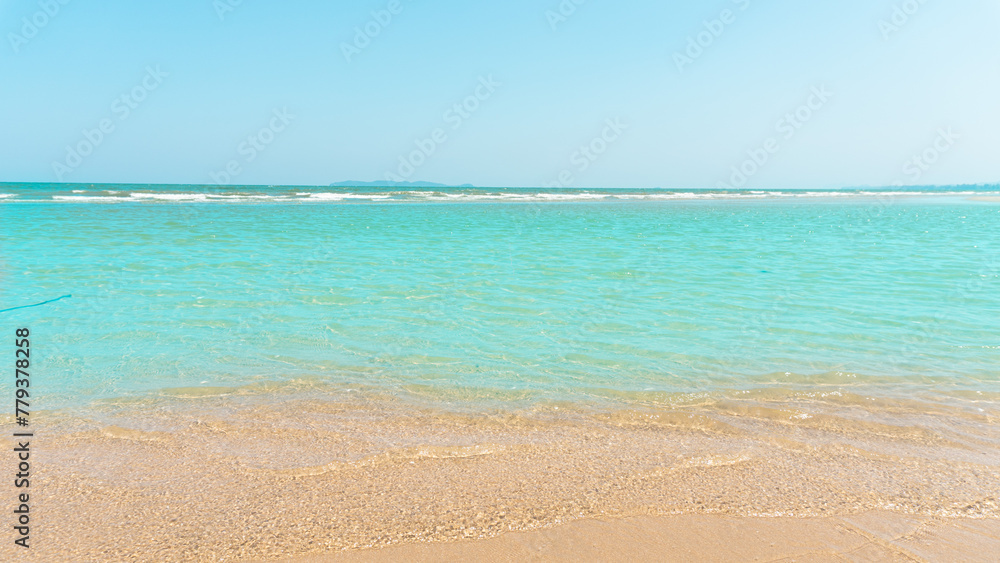 Palm tree on tropical beach with blue sky and white clouds abstract background. Copy space of summer vacation and business travel concept. Vintage tone filter effect color style.