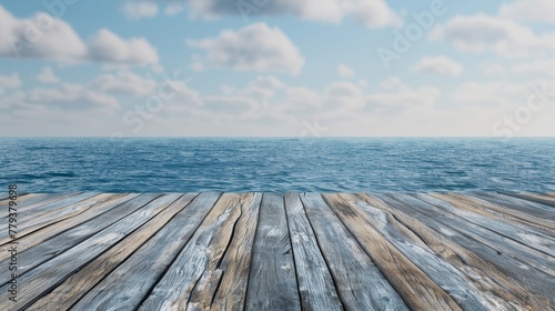 A wooden dock stretching out into the ocean waters with the blue sea in the background