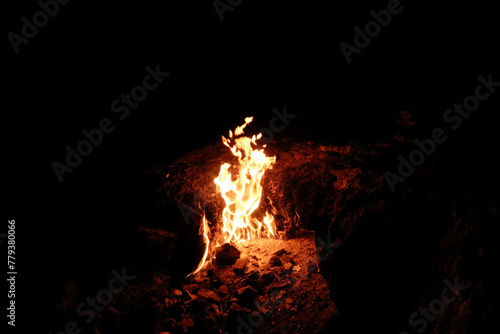 One of the eternal flames burning at Mount Chimaera at night, close to Antalya, Turkey