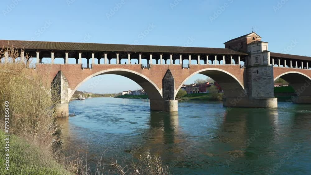 Panorama of Ponte Coperto bridge is over the Ticino river in Pavia at sunny day Panorama of Ponte Coperto bridge is over the Ticino river in Pavia at sunny day