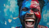 Man with face painted in blue and red colors joyfully shouting. The concept of emotions and patriotism.