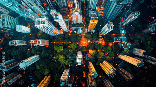 Aerial view of a bustling cityscape at night with illuminated streets, dense architecture, and surrounding greenery juxtaposing urban development.