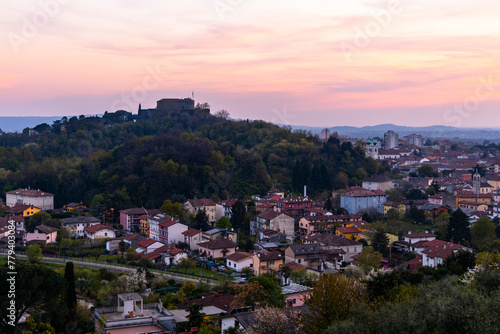 Gorizia Castle seen from the top of the hill over Nova-Gorica in Slovenia. Quiet day, relaxing places in the greenery, panorama with sunset and warm-colored clouds. Cultural Heritage Capital 2025.