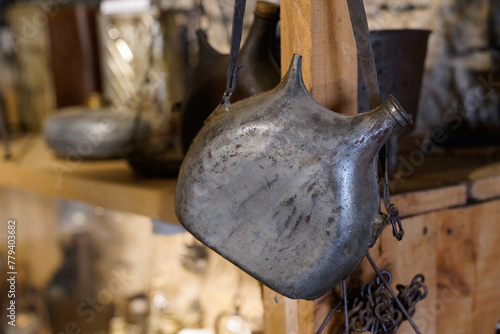 Old vintage metal flask ancient in farm museum Hures la Parade photo