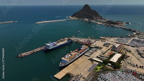 Aerial view backwards over the Port of Mazatlan and Isla El Crestón in sunny Mexico photo