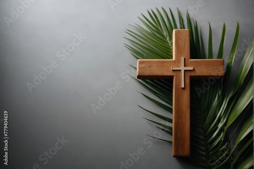 Wooden cross on a palm leaf with soft light