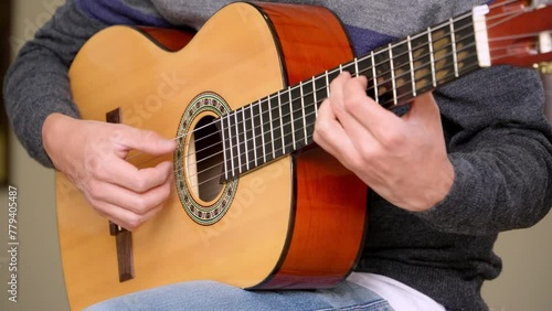 Close-up shot of a man playing the bossa nova rhythm photo