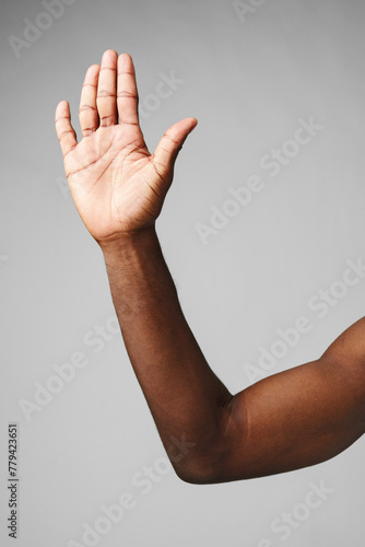 African Man Arm Raised in the Air