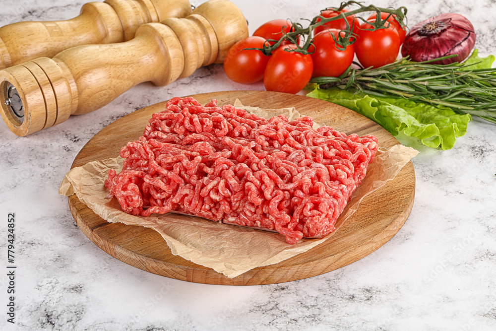 Raw minced beef meat on cutting board Raw minced beef meat on cutting board
