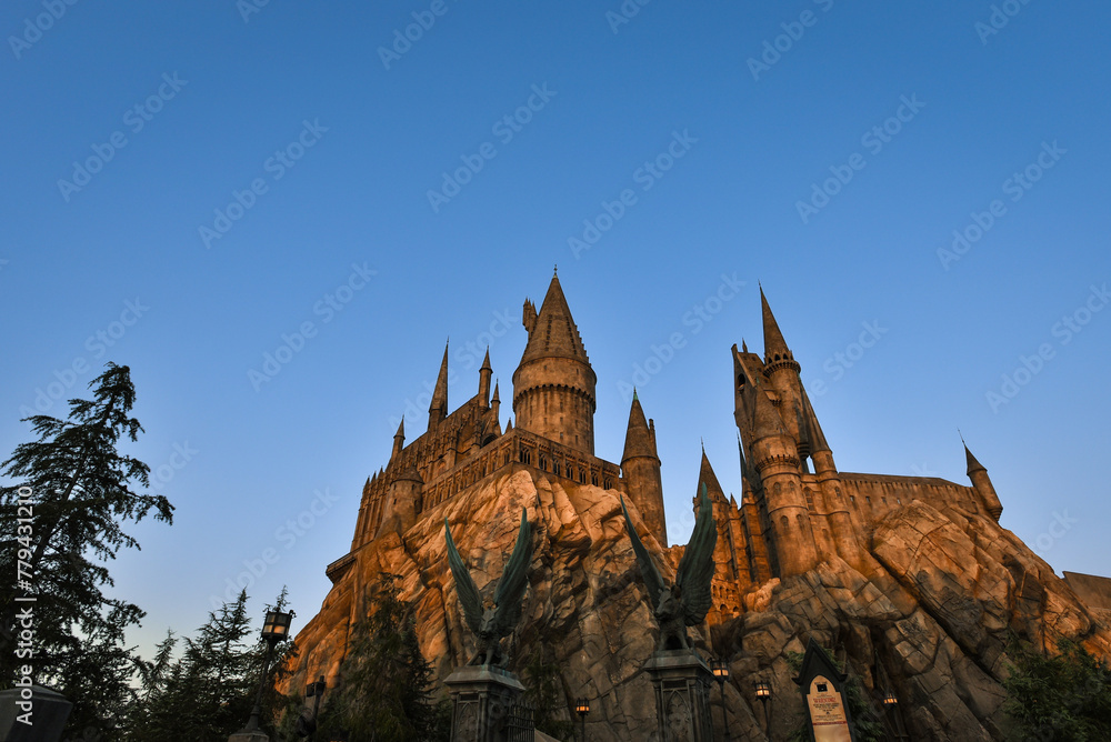 Fototapeta premium Sunset over Hogwarts Castle at the Wizarding World of Harry Potter in Universal Studios Hollywood - Los Angeles, California