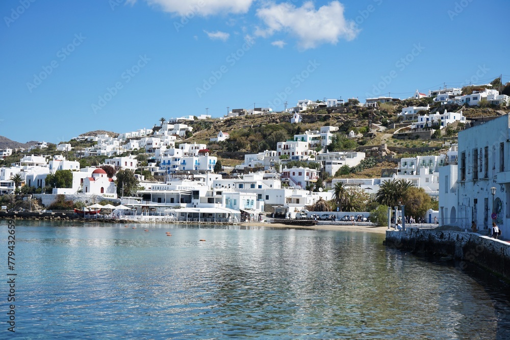 Panoramic landscape of the coast and mountains of Mykonos from the harbor of the Old Town in Mykonos, Greece