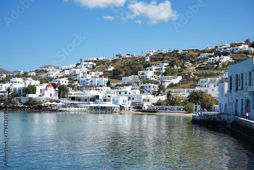 Panoramic landscape of the coast and mountains of Mykonos from the harbor of the Old Town in Mykonos, Greece