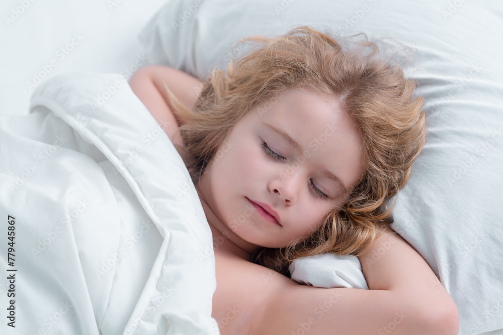 Lovely face of blonde caucasian child, sleeping on bed. Sweet dreams. Little baby boy sleeping while lying on bed at home. Lovely face of blonde caucasian child, sleeping on bed. Sweet dreams. Little baby boy sleeping while lying on bed at home.