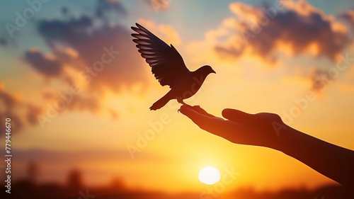 Wallpaper Mural Silhouette of a hand releasing a bird at sunset symbolizes peace and freedom AI Generative. Torontodigital.ca