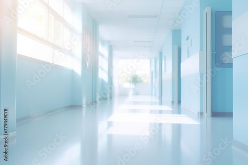 Bright empty defocused hospital corridor background