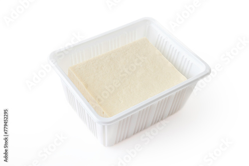 A loaf of tofu on a white background