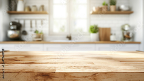 empty beautiful wood table top counter and blur bokeh modern kitchen interior background in clean and bright. © Jrprr