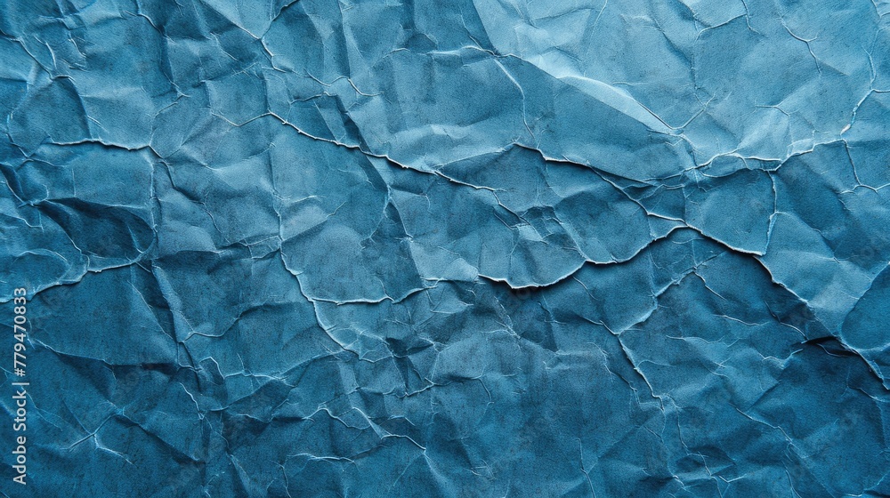 Obraz premium Blue crumpled paper background.
