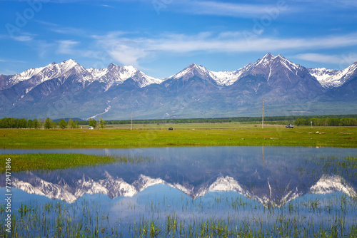 Russia. Landscape with mountains reflecting in the water on summer day. Buryatia, Tunkinskaya valley photo