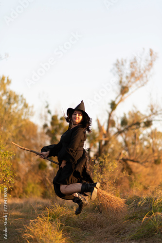 A witch dressed in black dress in the forest  © PumpedVisuals