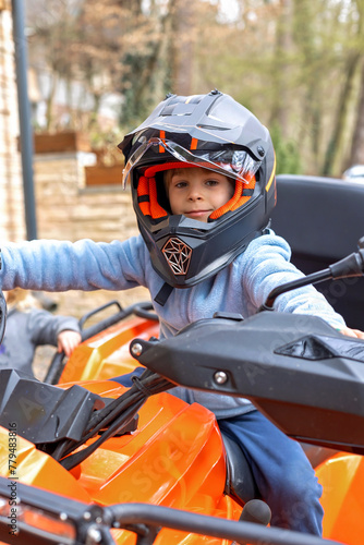 Children, riding on a buggy wheel with father, fast fourwheeler