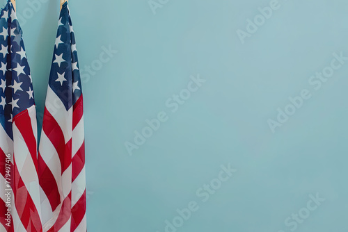 Independence Day (July 4th, in the us) Two USA flags on a blue background, copy space concept for National provender day  photo