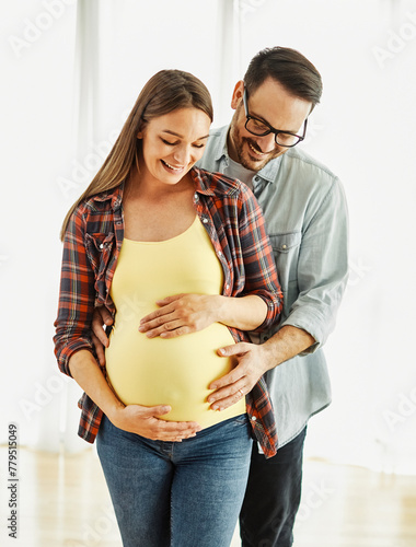 woman pregnant couple man pregnancy family mother love father happy husband baby wife belly expecting bonding happiness maternity parent holding hugging hug