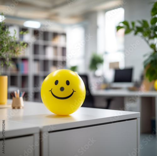 Sunny Workplace Vibes: Spreading Positivity with a Yellow Smiling Ball