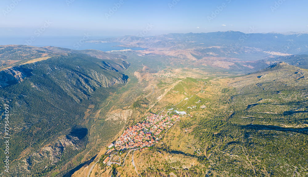 Delphi, Greece. Modern city. View of the valley. Sunny weather, Summer morning. Aerial view