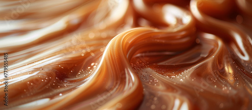 Melted smooth liquid caramel texture abstract background. Sweet food.