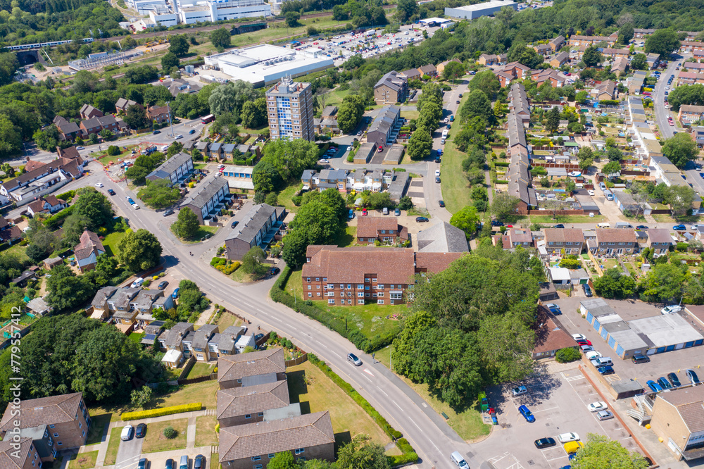 Fototapeta premium Aerial photo of the British town of Stevenage in Hertfordshire UK showing a typical British housing estate with rows of houses in the village, on a hot sunny summers day.