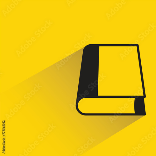 book icon with shadow on yellow background