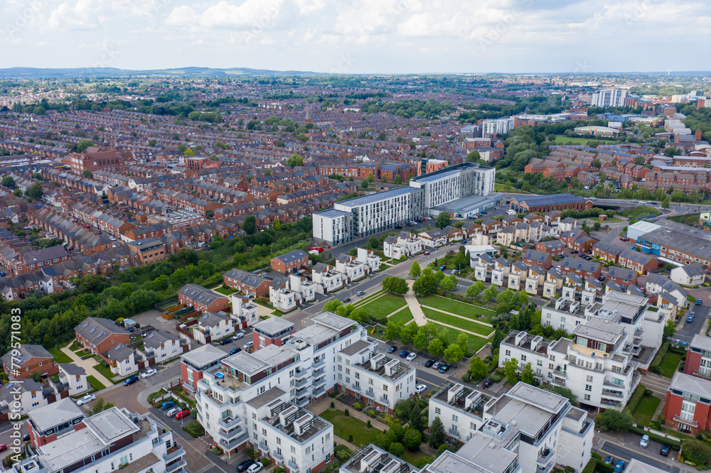 Aerial photo of the city centre of Leicester in the UK showing houses and apartment building on a sunny summers day with white clouds in the sky