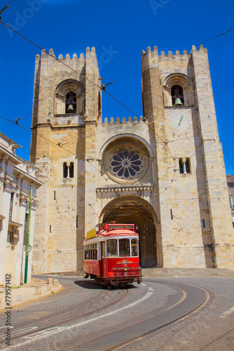 Se cathedral church with traditional tram at sunny day, Lisbon, Portugal photo