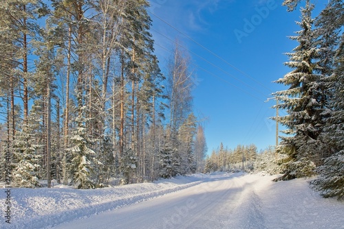 The snow has been plowed from the road in cold winter weather, Loppi, Finland. photo