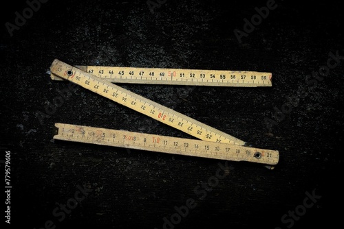 Top view of the zigzag folding rule isolated on the empty black background