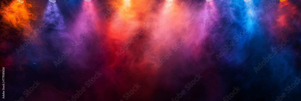 Vivid smoke and lights illuminate the stage in a colorful display.