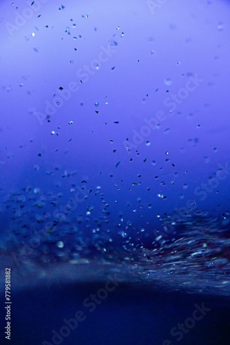 Vertical shot of water water droplets -good match for backgrounds and wallpapers