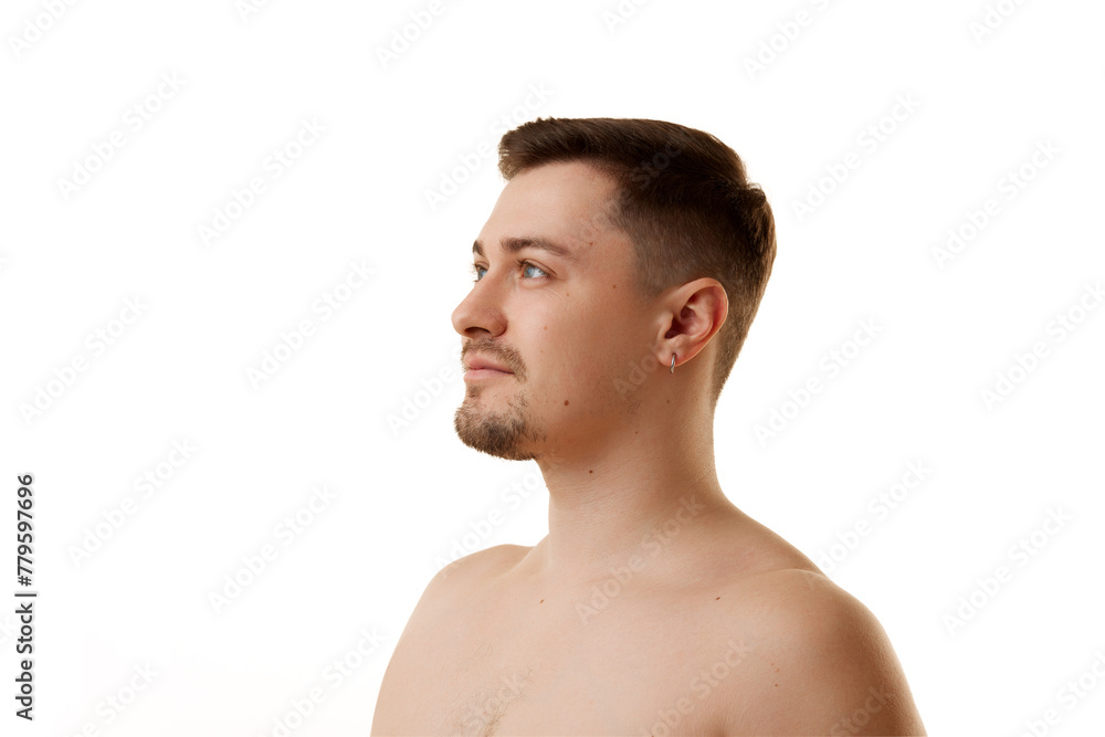 Profile view of half-naked man looking away with light smile against white studio background. Concept of natural beauty, male health, anti-aging, spa procedures, cosmetic products. Profile view of half-naked man looking away with light smile against white studio background. Concept of natural beauty, male health, anti-aging, spa procedures, cosmetic products.
