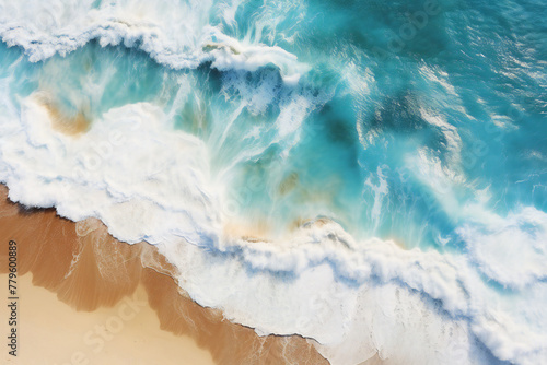 Aerial View of Turquoise Waves Crashing on a Golden Sandy Beach