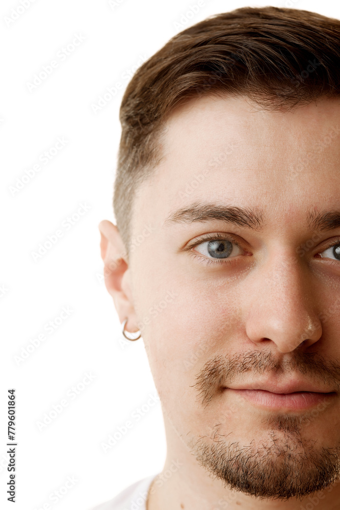Obraz premium Cropped portrait of young attractive man with beard looking at camera against white studio background. Half-portrait. Concept of natural beauty, male health, anti-aging, procedures, cosmetic products.