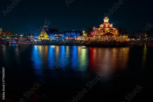 Night view of illuminated Shoreline Village with waterfront in Long Beach, California
