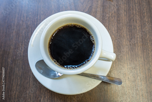 Black americano coffee on wooden table