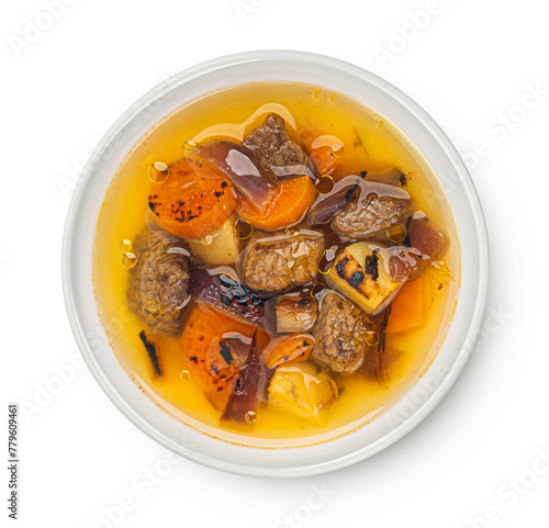 Beef stew with broth, soup with meat isolated on white background, top view