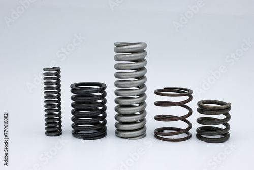 Set of metal springs. Different shapes and sizes. White background. 